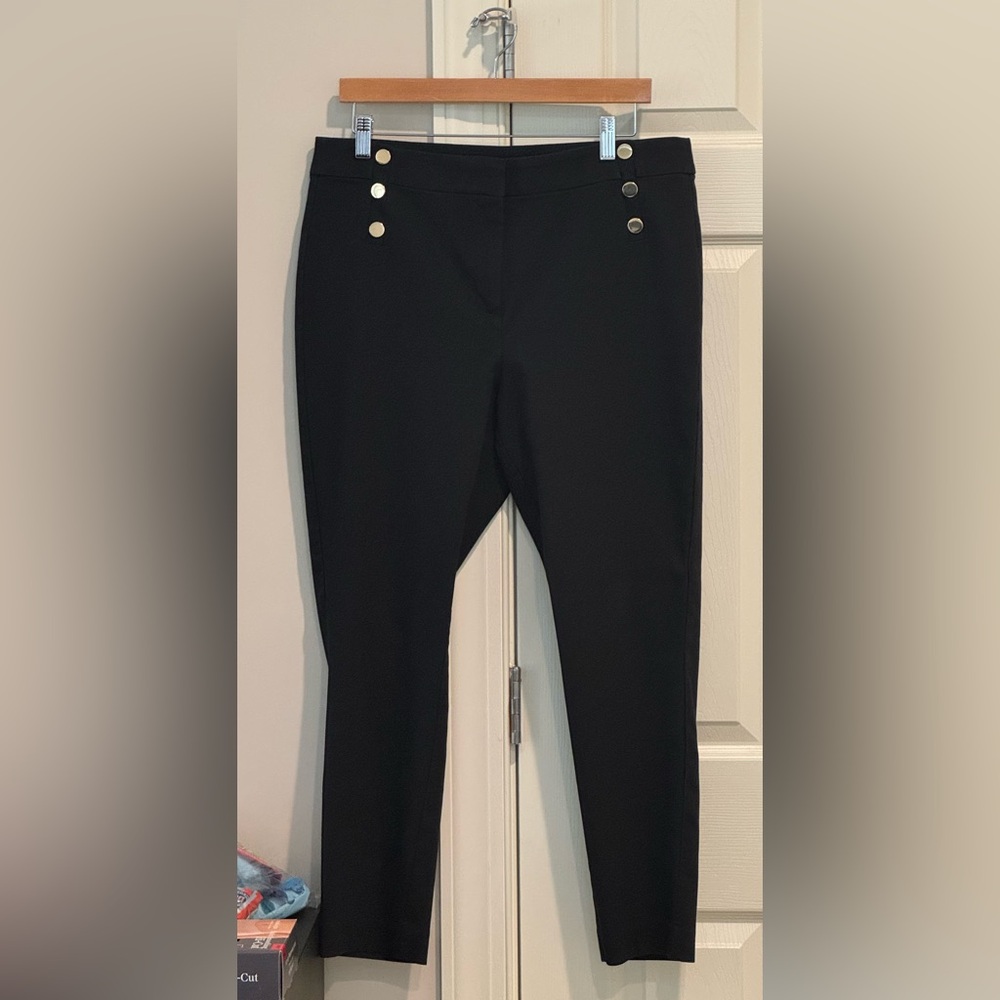 Womens black pants with gold button detail. High waist and curvy skinny fit.